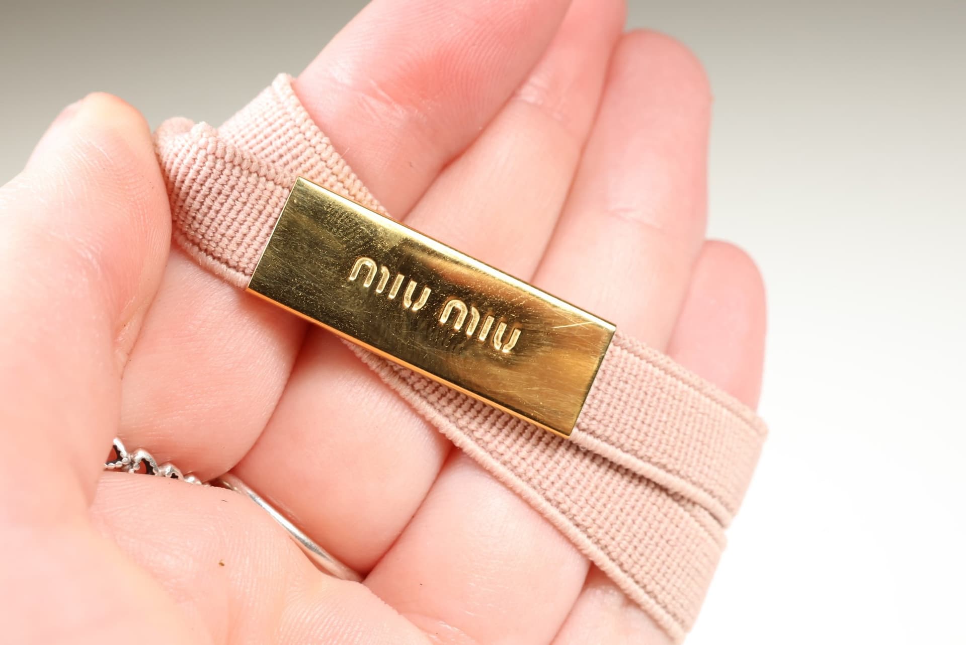 Miu Miu Pink Elastic Headband Hair Band Gold Tone Logo Plaque Hair Accessory accessories auction at Alighieri's