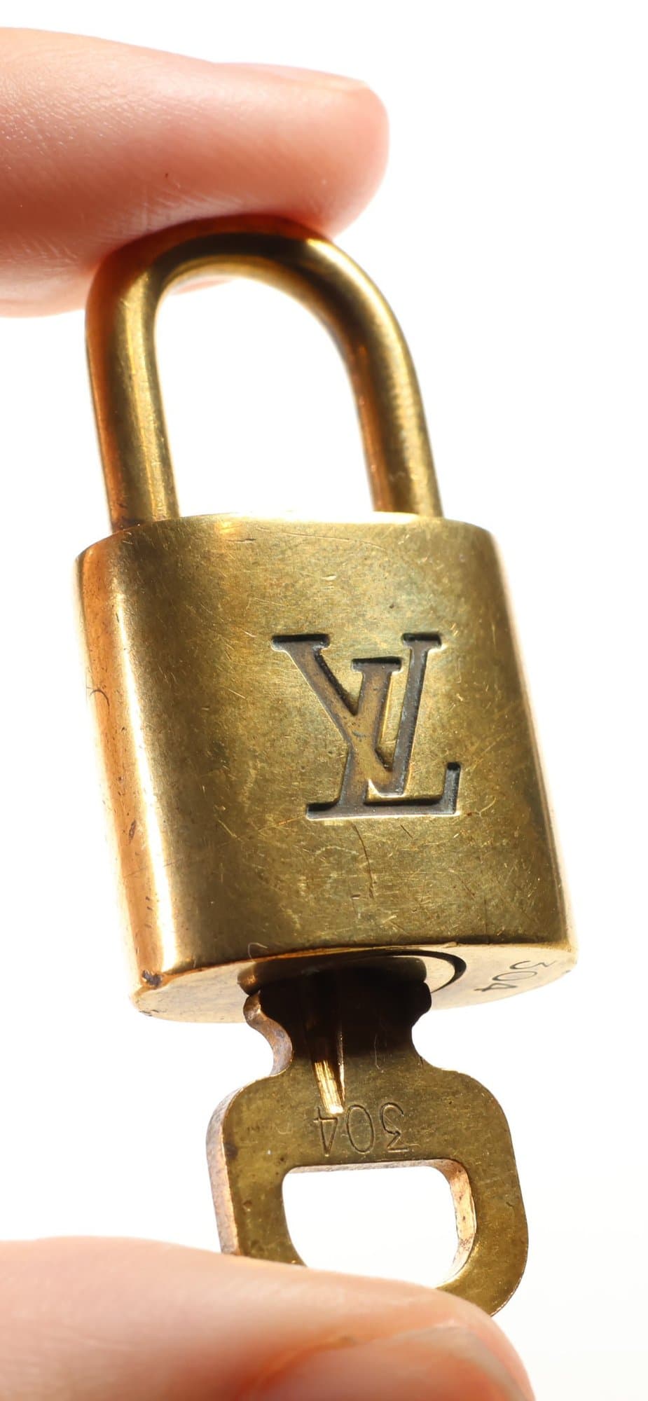 Louis Vuitton Padlock And Key Set Number 304 Gold Tone Lock LV Logo Bag Accessory handbags auction at Alighieri's