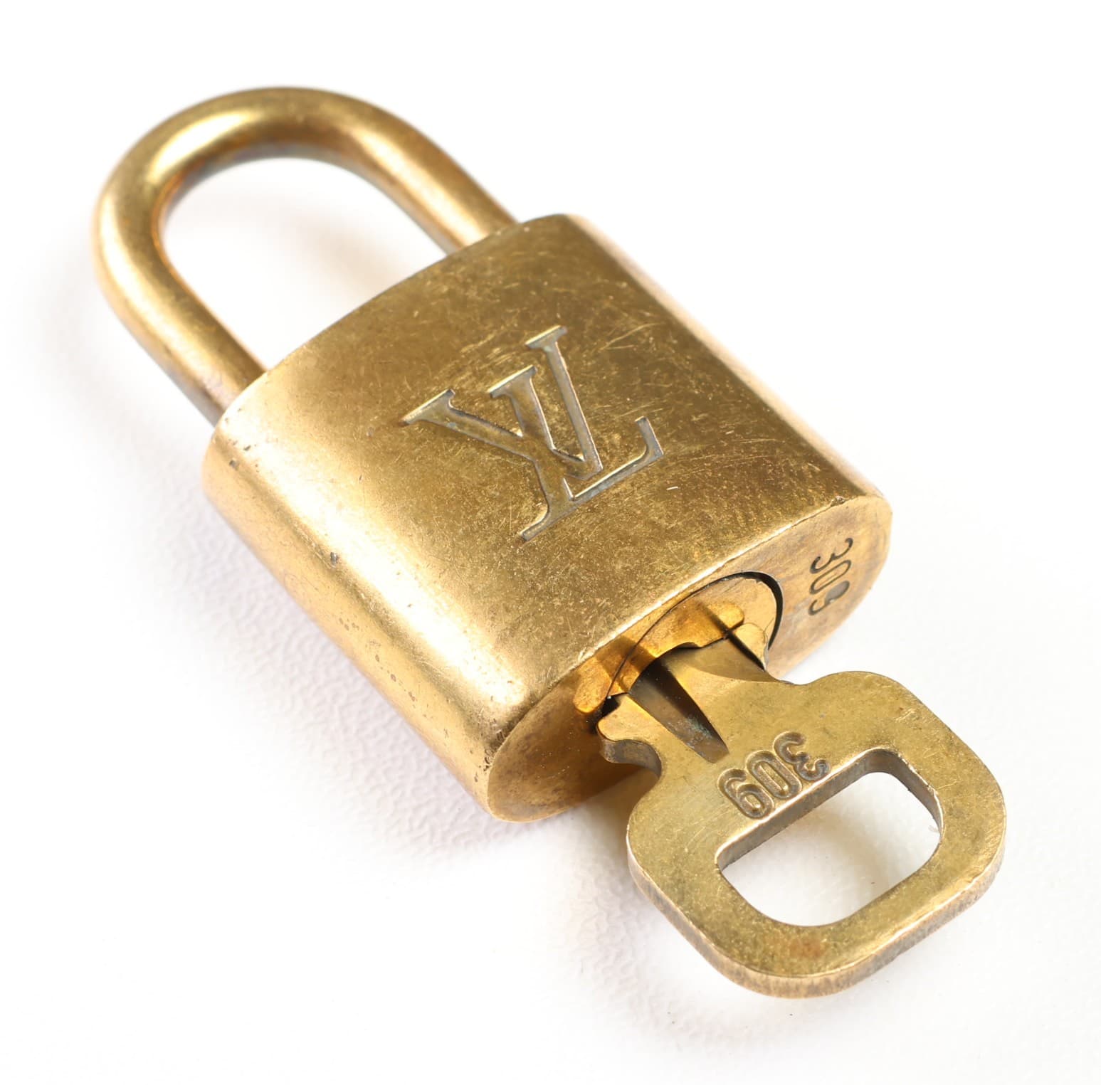 Louis Vuitton Padlock And Key Set Number 309 Gold Tone Bag Lock Handbag Accessory handbags auction at Alighieri's