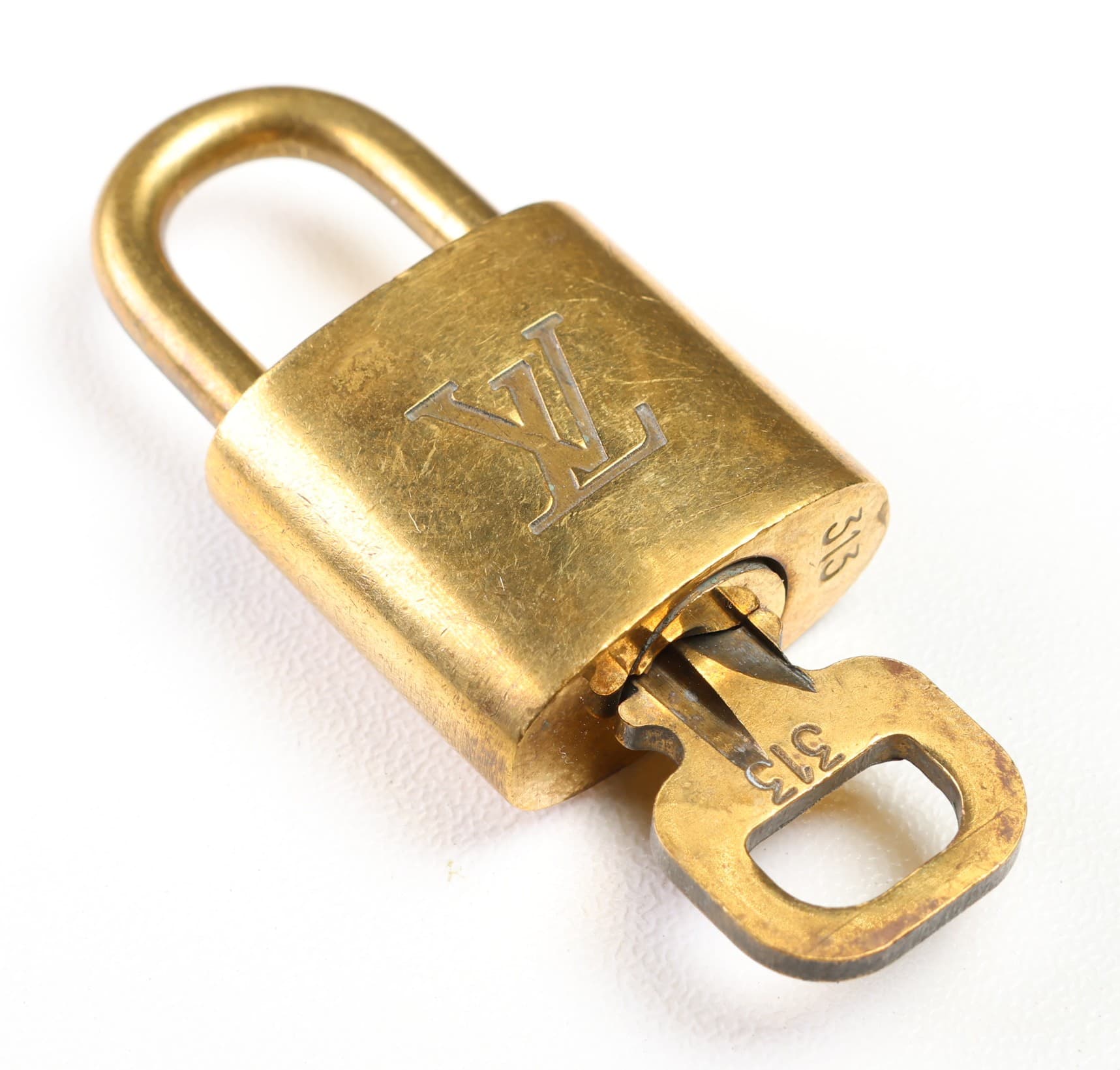 Louis Vuitton Padlock And Key Set Gold Tone LV Logo Bag Lock Handbag Purse Accessory handbags auction at Alighieri's